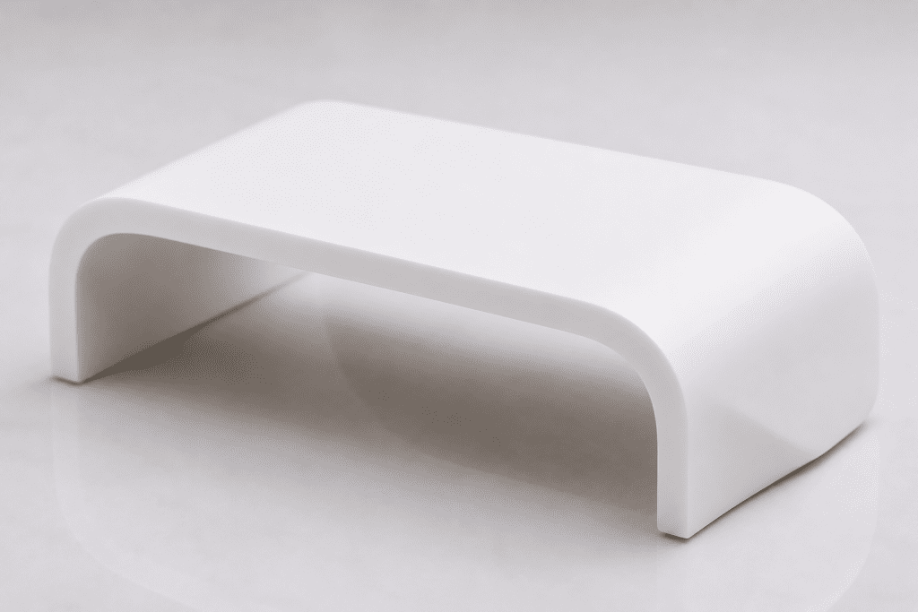 Curved acrylic solid surface thermoforming application demonstrating seamless fabrication capability for architectural interiors.
