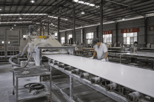 Acrylic solid surface sheet production line in a manufacturing facility